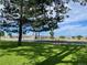 Parking lot with lush green grass and a bike rack at 7930 Larkspur Cir, Frederick, CO 80530