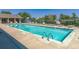 Sparkling community pool with lounge chairs and well-maintained surroundings at 7930 Larkspur Cir, Frederick, CO 80530