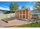 Backyard shed features a raised garden bed with a white fence and a bench at 7930 Larkspur Cir, Frederick, CO 80530