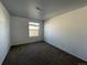 Cozy bedroom features plush carpeting, a window for natural light, and neutral tones for relaxation at 16485 E 17Th Pl # D, Aurora, CO 80011