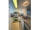 Well-equipped kitchen features white appliances, granite countertops, and tile floors for easy cleanup at 16485 E 17Th Pl # D, Aurora, CO 80011