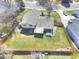 Aerial view of the property showcasing the spacious backyard, patio, and surrounding neighborhood at 8561 E Grand Ave, Denver, CO 80237