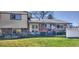 Backyard featuring a patio area, well-maintained lawn, and privacy fence at 8561 E Grand Ave, Denver, CO 80237