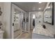 Bathroom featuring double sinks, recessed lighting and mirrors at 8561 E Grand Ave, Denver, CO 80237