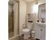 Cozy bathroom featuring a shower, toilet, vanity with sink, modern lighting, and neutral color palette at 8561 E Grand Ave, Denver, CO 80237