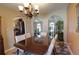 Dining room with chandelier, arched doorway and wood table at 8561 E Grand Ave, Denver, CO 80237