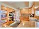 Kitchen with granite counters, stainless appliances and breakfast bar at 8561 E Grand Ave, Denver, CO 80237