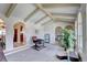 Bright living room with vaulted ceilings, arched windows and neutral carpets at 8561 E Grand Ave, Denver, CO 80237