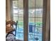 A cozy patio visible through glass doors features a fire pit, furniture, and a view of the backyard at 8561 E Grand Ave, Denver, CO 80237
