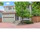Charming two-story home with a well-maintained lawn, mature tree, and attached garage at 1449 Braewood Ave, Highlands Ranch, CO 80129