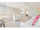 Open loft area with contemporary furniture, a modern chandelier, and bright natural light, ideal for relaxation at 1449 Braewood Ave, Highlands Ranch, CO 80129