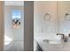 Powder room featuring a sleek vanity, and scenic views from the adjacent room at 16798 W 94Th Way, Arvada, CO 80007