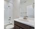 Bathroom featuring a sleek vanity, bathtub and shower at 16798 W 94Th Way, Arvada, CO 80007
