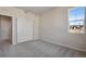 Bedroom with neutral carpet, walk in closet and a scenic view at 16798 W 94Th Way, Arvada, CO 80007