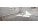 Spacious bedroom with plush carpeting and ample natural light from multiple windows at 16798 W 94Th Way, Arvada, CO 80007
