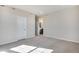Large bedroom with carpeting, neutral walls, and an ensuite bathroom for convenience at 16798 W 94Th Way, Arvada, CO 80007
