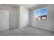 Spacious bedroom featuring neutral carpet, closet and a window at 16798 W 94Th Way, Arvada, CO 80007