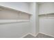 Walk in closet featuring carpet and multiple shelving racks at 16798 W 94Th Way, Arvada, CO 80007