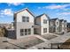 Modern townhome complex featuring stylish exteriors, well-kept landscaping, and community walkways at 16798 W 94Th Way, Arvada, CO 80007
