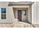 Inviting front entrance with a stylish door, modern fixtures, and clear address numbers at 16798 W 94Th Way, Arvada, CO 80007
