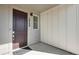 Welcoming front entryway with a contemporary door, visible house number, and sleek design at 16798 W 94Th Way, Arvada, CO 80007