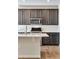 Bright kitchen boasts modern cabinetry, stainless steel appliances, and a large island at 16798 W 94Th Way, Arvada, CO 80007