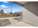 Covered patio area showcasing a pleasant outdoor view and modern architectural details at 16798 W 94Th Way, Arvada, CO 80007