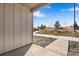 Covered patio area showcasing a pleasant outdoor view and modern architectural details at 16798 W 94Th Way, Arvada, CO 80007