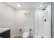 Modern bathroom featuring a glass-enclosed shower and vanity at 715 W 7Th Ave, Denver, CO 80204