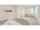 Cozy bedroom includes a neutral paint scheme, shelving, and closet at 715 W 7Th Ave, Denver, CO 80204