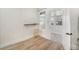 Light filled room includes wood floors, stool and beverage shelf and views to additional sun room at 715 W 7Th Ave, Denver, CO 80204