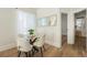 Cozy dining area with a glass table, plush chairs, and natural light at 715 W 7Th Ave, Denver, CO 80204