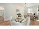 Bright dining space with modern lighting and open access to the living area at 715 W 7Th Ave, Denver, CO 80204