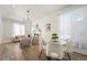 Open-concept space connecting living and dining areas with lots of natural light at 715 W 7Th Ave, Denver, CO 80204