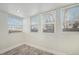 Sun room offers natural light with multiple windows and neutral paint at 715 W 7Th Ave, Denver, CO 80204