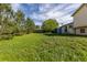 Spacious backyard with green grass and mature trees at 3194 W 9Th Avenue Pl, Broomfield, CO 80020