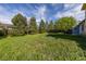 View of a spacious backyard with lush greenery and a secure fence at 3194 W 9Th Avenue Pl, Broomfield, CO 80020