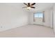 Spacious bedroom with a ceiling fan and a window providing natural light at 3194 W 9Th Avenue Pl, Broomfield, CO 80020