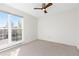 Bright bedroom featuring a ceiling fan and a large window for natural light at 3194 W 9Th Avenue Pl, Broomfield, CO 80020