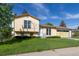 Two-story home with blue and yellow exterior at 3194 W 9Th Avenue Pl, Broomfield, CO 80020