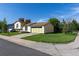 Charming yellow home with garage and landscaped front yard at 3194 W 9Th Avenue Pl, Broomfield, CO 80020