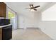 Galley kitchen features a door to the outside, wood cabinets and a ceiling fan at 3194 W 9Th Avenue Pl, Broomfield, CO 80020