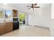 A cozy kitchen features a ceiling fan and a sliding glass door to the outside at 3194 W 9Th Avenue Pl, Broomfield, CO 80020