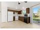 Functional kitchen featuring white appliances and dark wood cabinets at 3194 W 9Th Avenue Pl, Broomfield, CO 80020