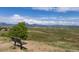 Scenic overlook featuring a wooden bench with a view of the plains and mountains at 3194 W 9Th Avenue Pl, Broomfield, CO 80020