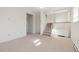 Comfortable living room features a staircase and a hallway to a bedroom at 3194 W 9Th Avenue Pl, Broomfield, CO 80020