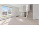 Bright living room features a large window, front door and staircase leading to the second floor at 3194 W 9Th Avenue Pl, Broomfield, CO 80020