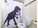 Bathroom with dinosaur shower curtain and toilet at 974 S Zeno Way, Aurora, CO 80017