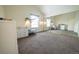 Main bedroom with mirrored closet doors and neutral carpeting at 974 S Zeno Way, Aurora, CO 80017