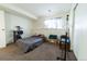 Basement bedroom with a bed and cat tree at 974 S Zeno Way, Aurora, CO 80017